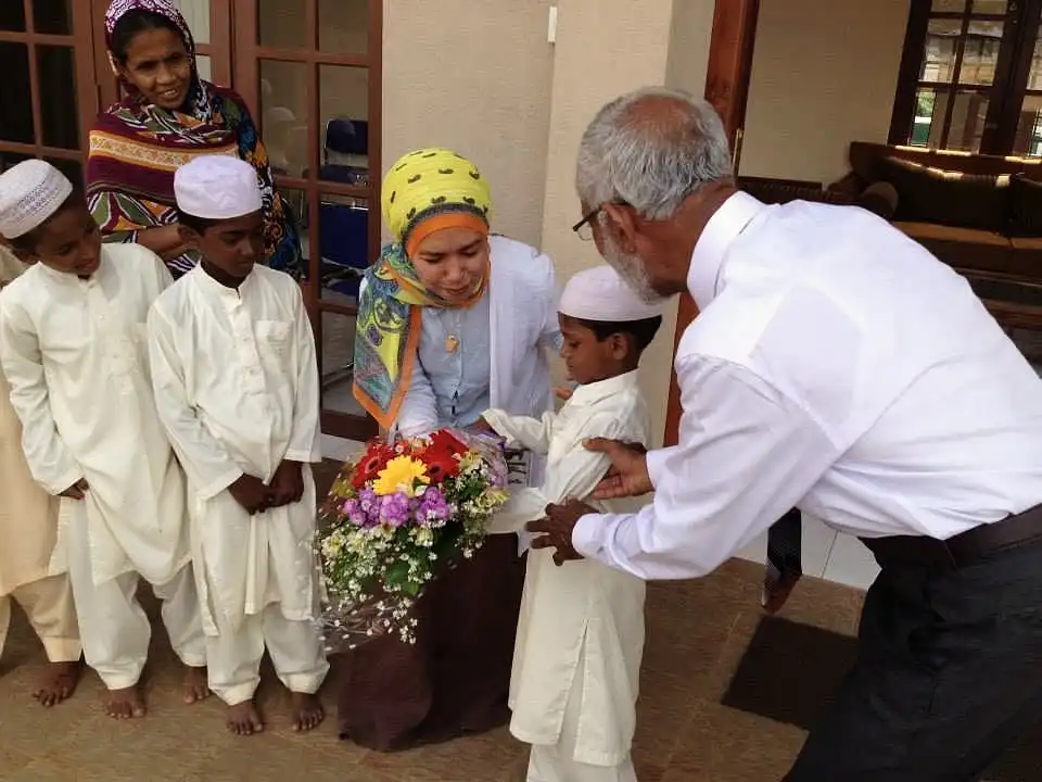 Handing over bouquet by the youngest boy