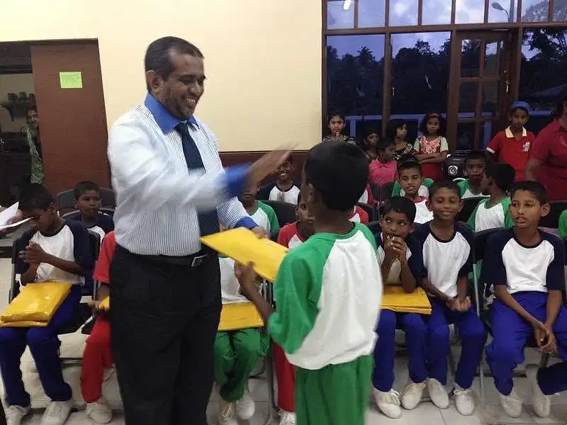 Principal handing over the prizes