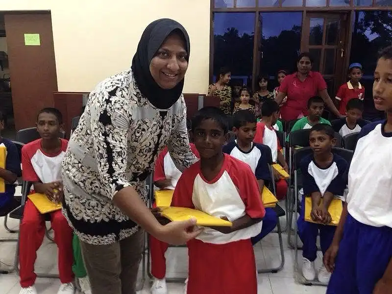 Director of Operations AAMMF, Sheroon handing over the prizes
