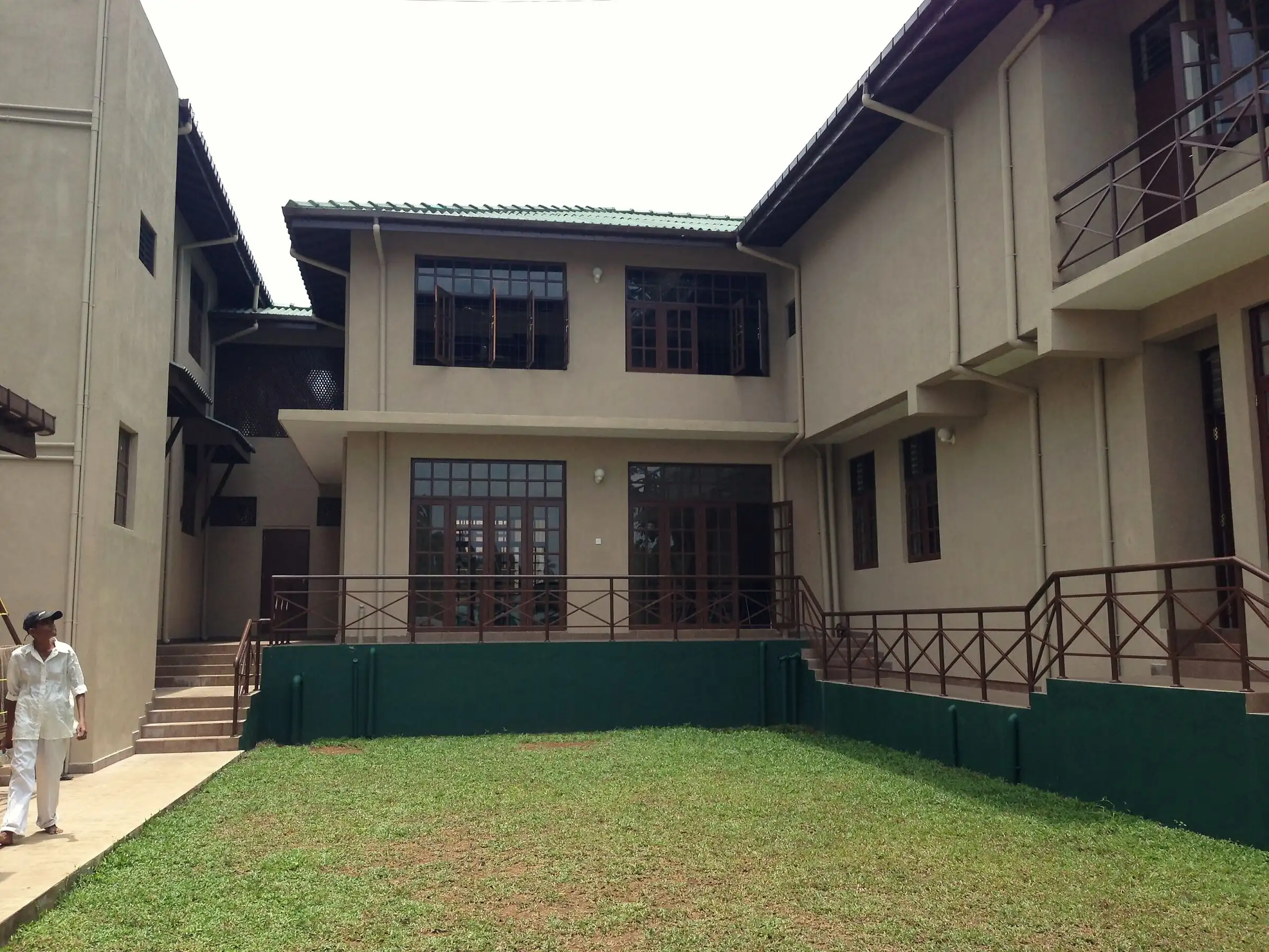 The courtyard and lawn behind Give Light Home